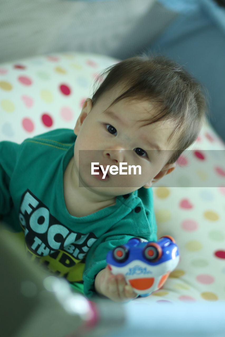 Portrait of cute baby boy at home