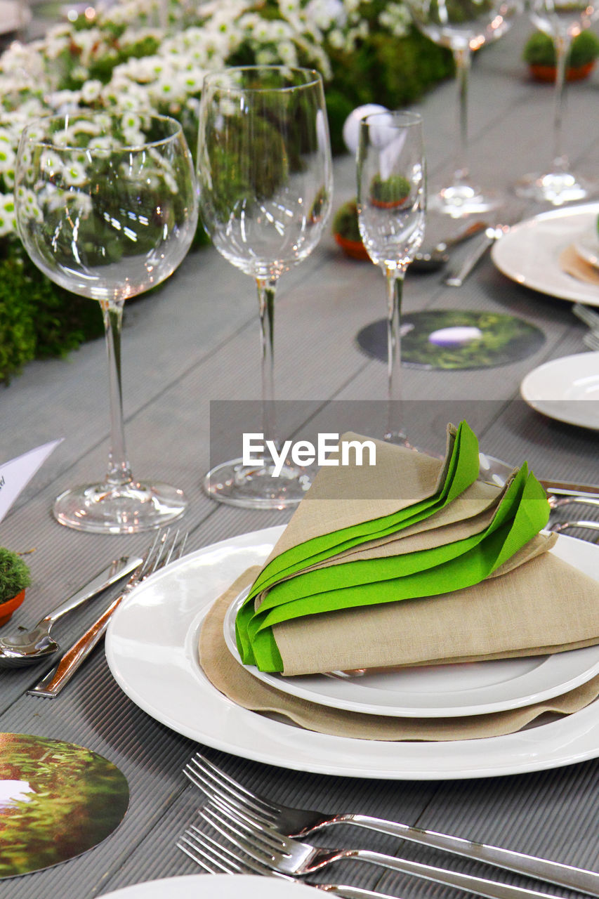 CLOSE-UP OF WINE WITH GLASSES ON TABLE