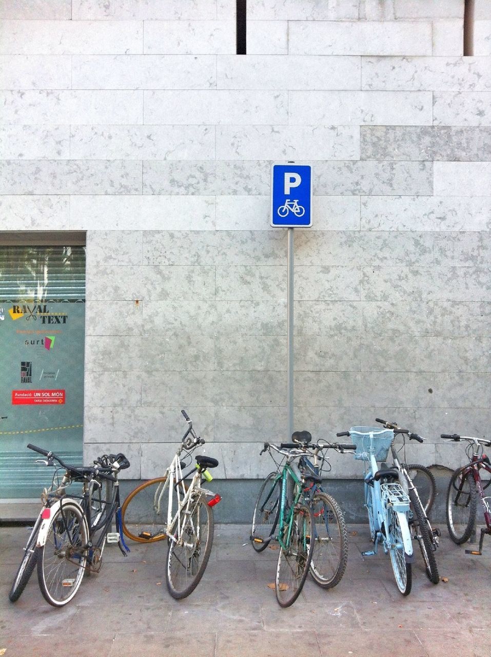 BICYCLES PARKED ON WALL