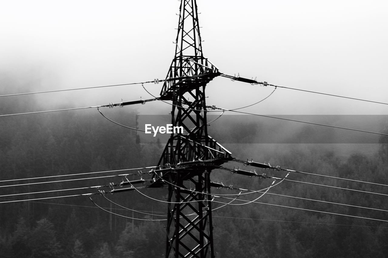 LOW ANGLE VIEW OF ELECTRICITY PYLON