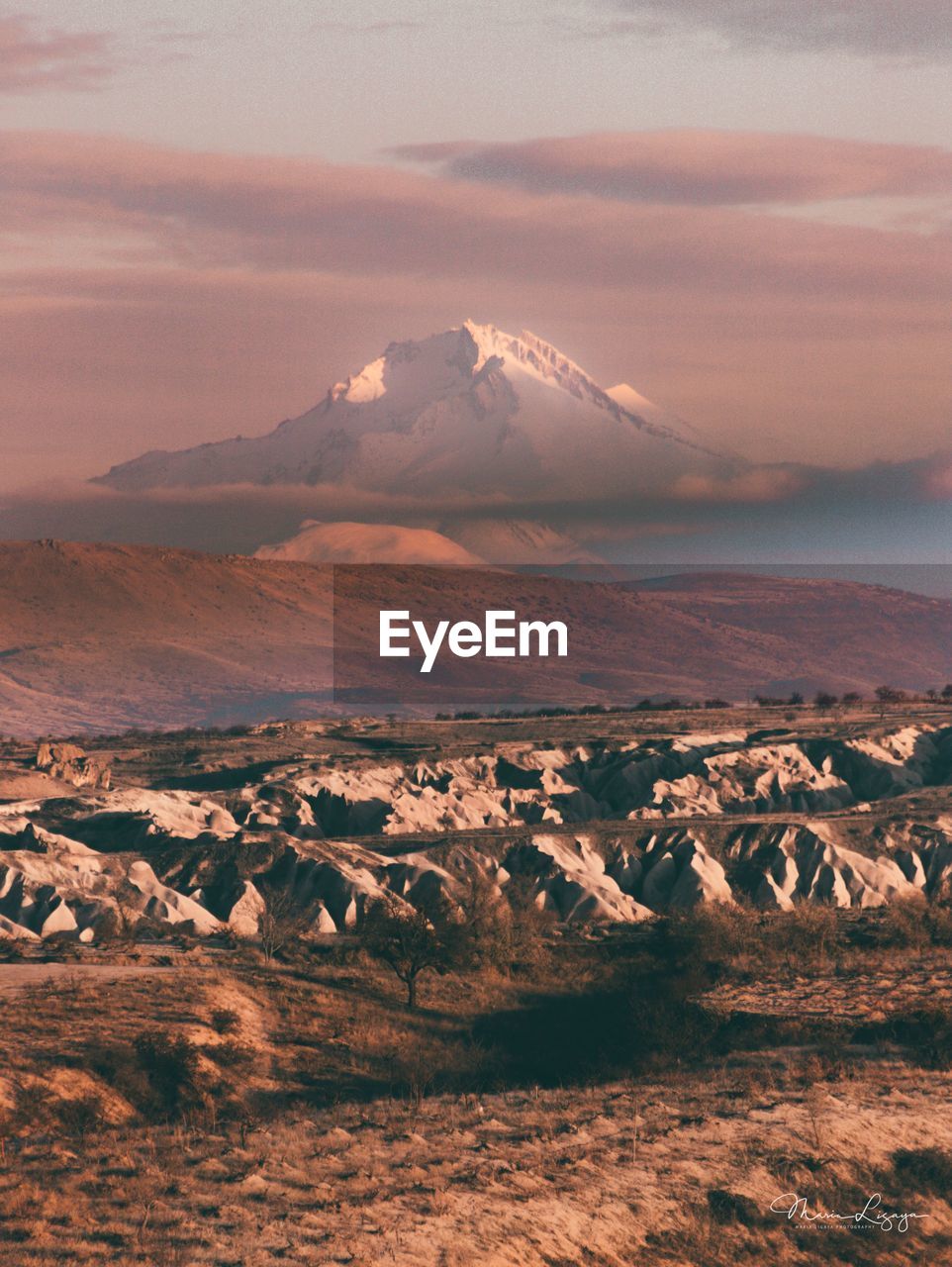 Aerial view of landscape against sky during sunset