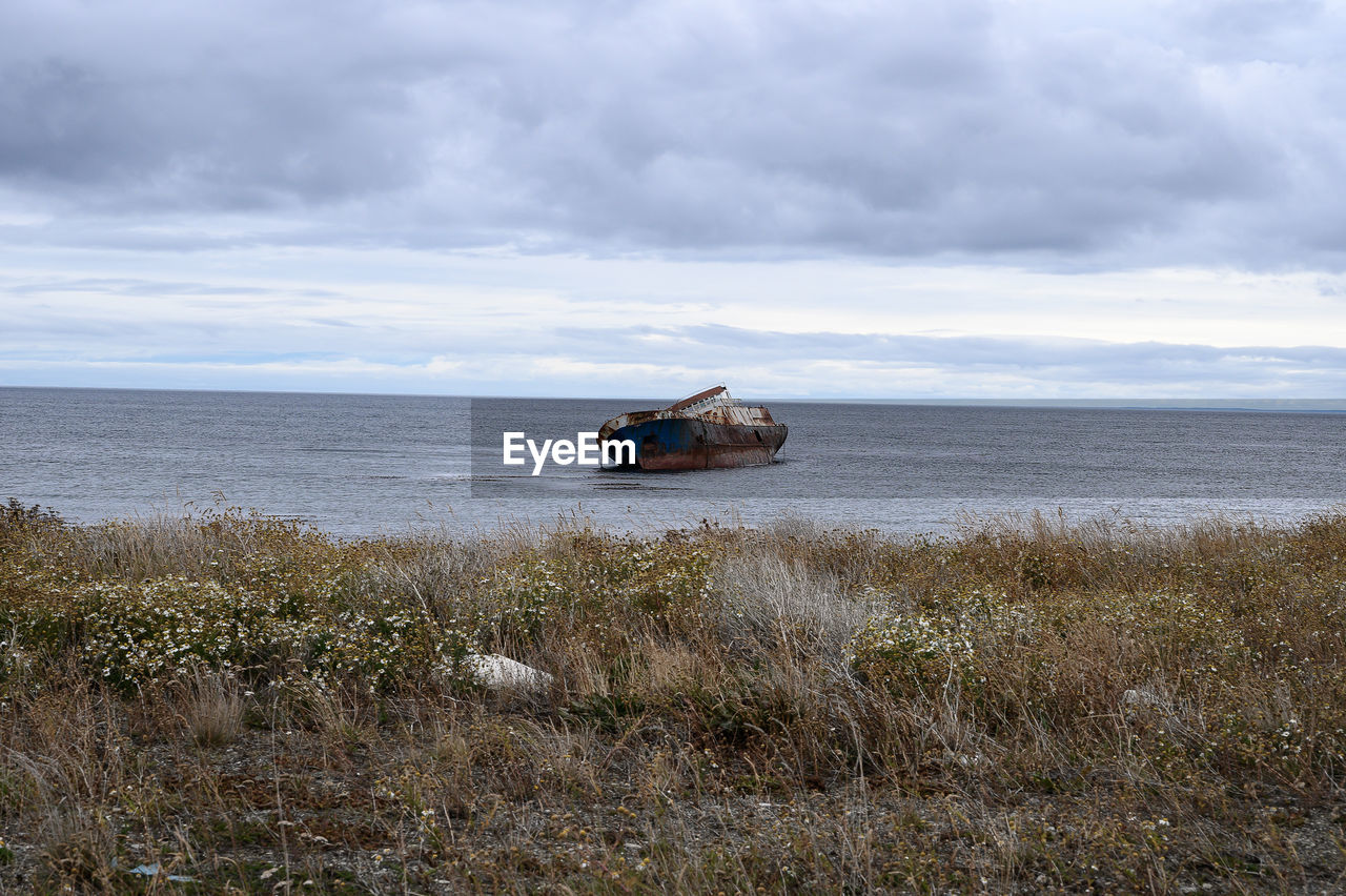 Nautical vessel on sea against sky