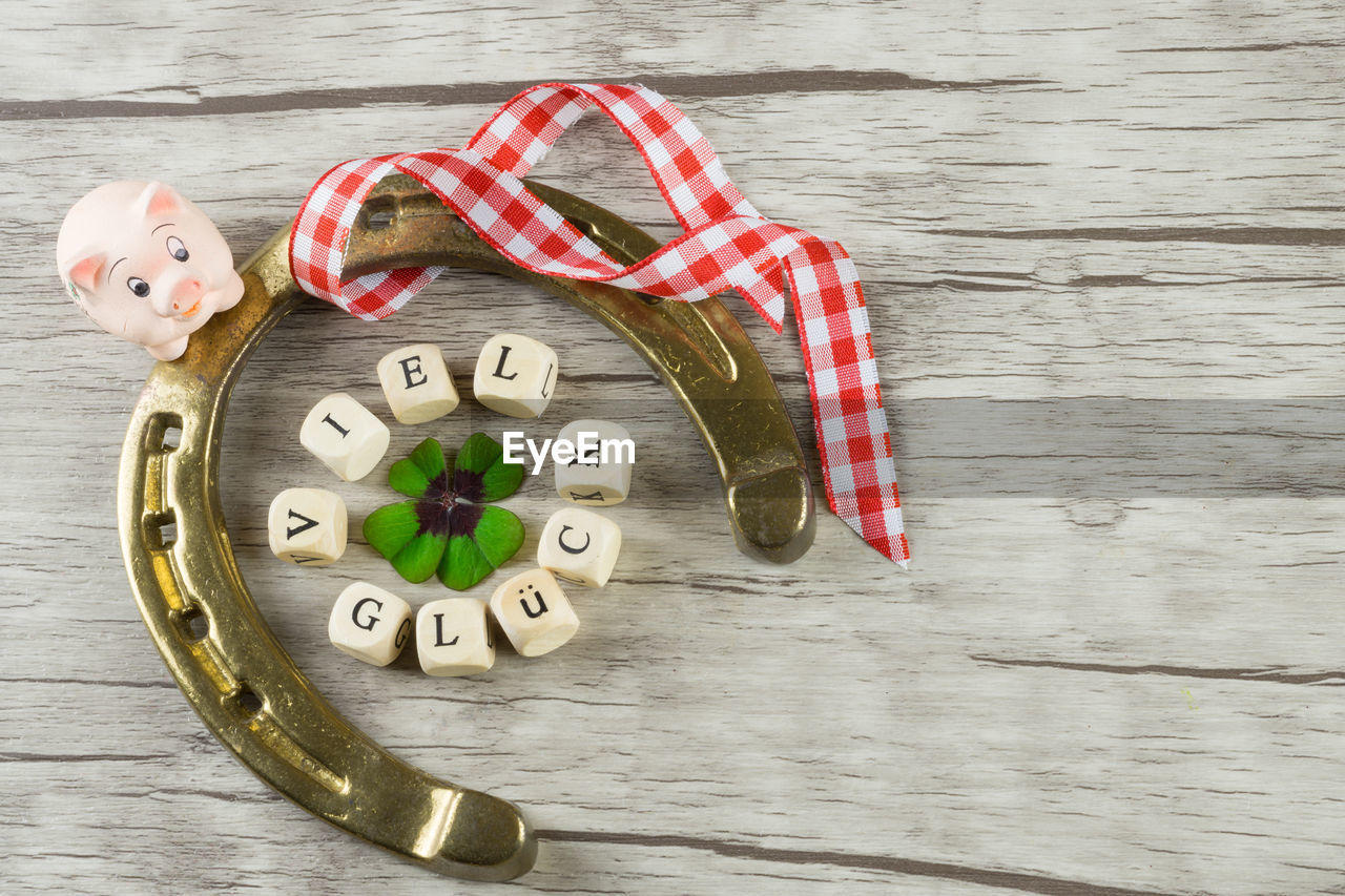 Close-up of horseshoe and christmas decorations on table