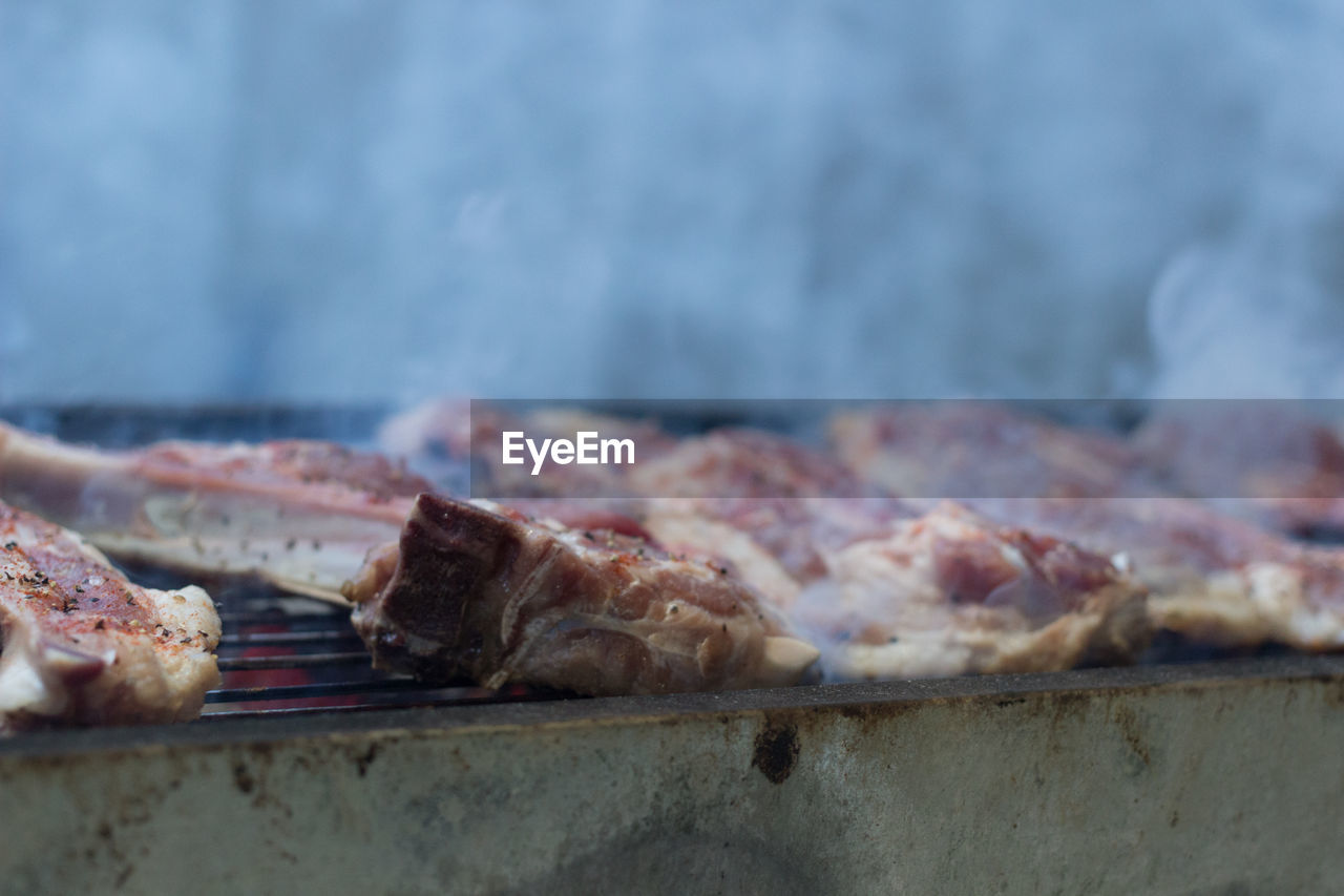 Close-up of meat on barbecue grill