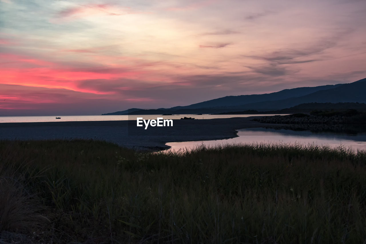 SCENIC VIEW OF SEA DURING SUNSET