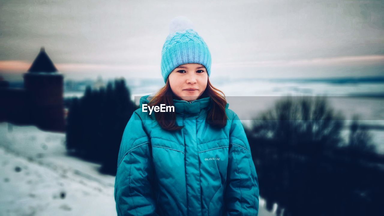 Portrait of teenage girl standing during winter