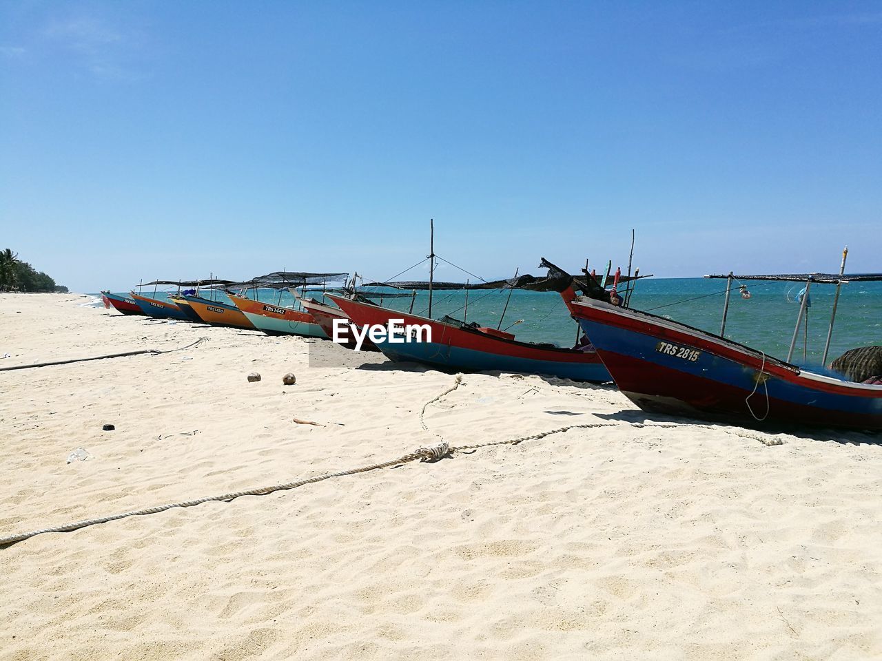 PANORAMIC VIEW OF BEACH AGAINST CLEAR BLUE SKY