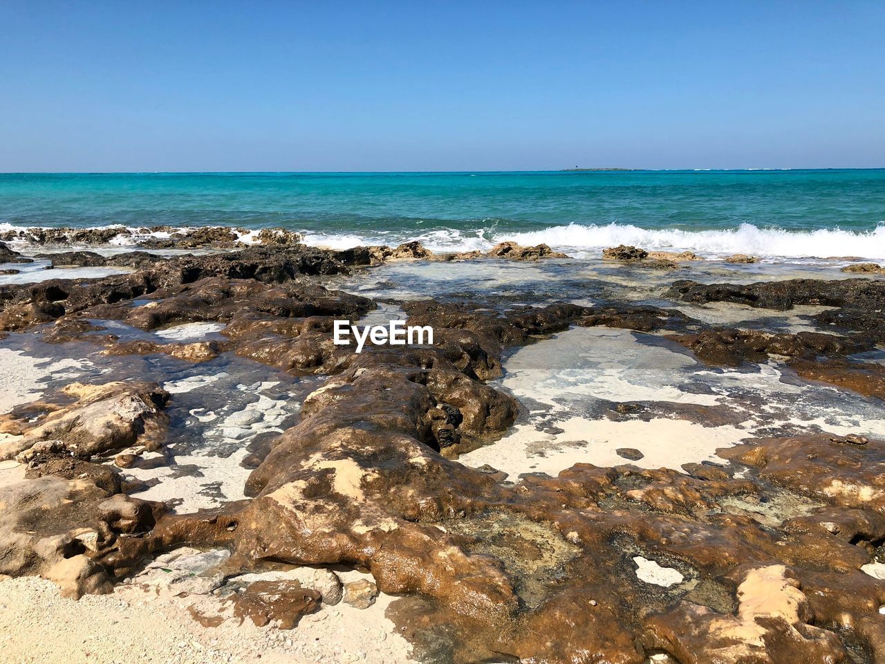 Scenic view of sea against clear sky