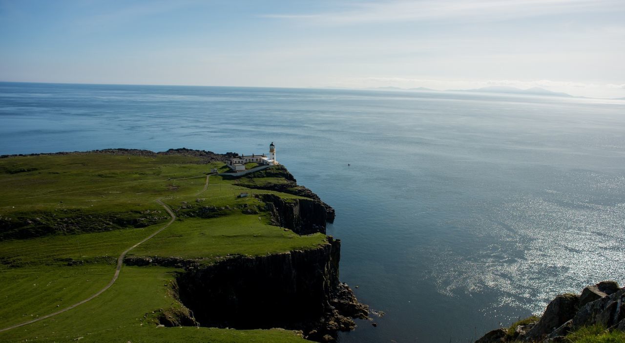 Aerial view of neist point lighthouse against horizon