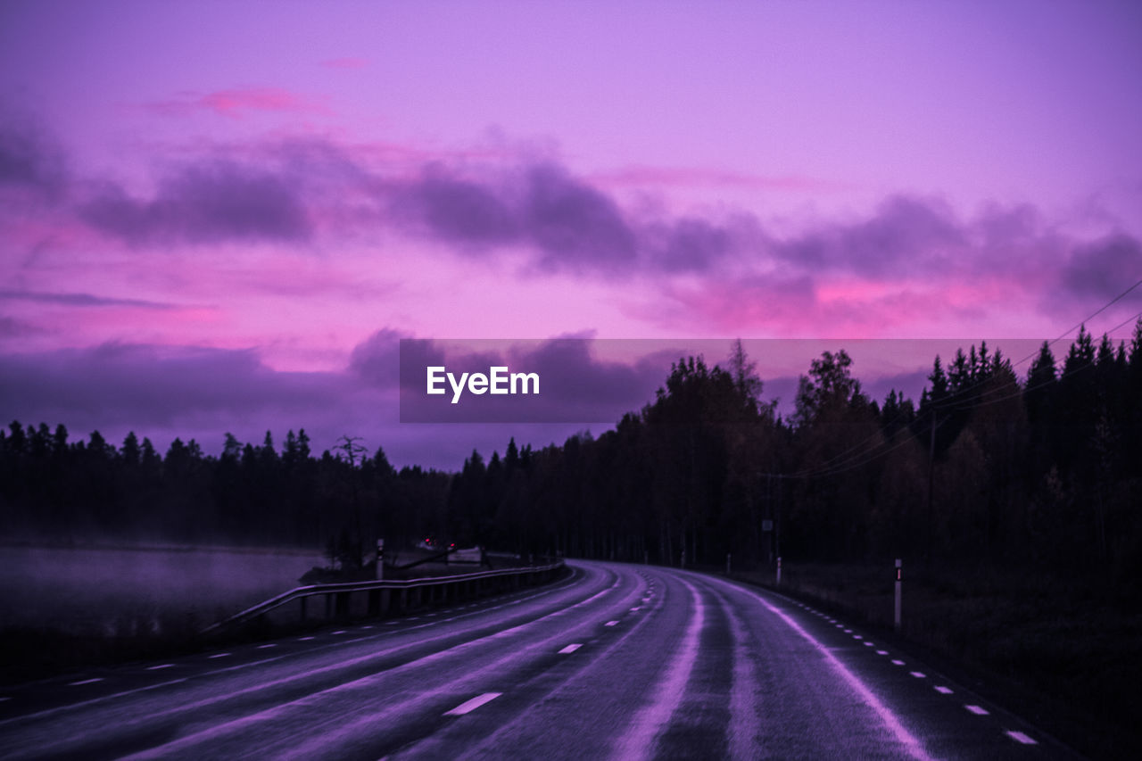 ROAD AGAINST SKY DURING SUNSET