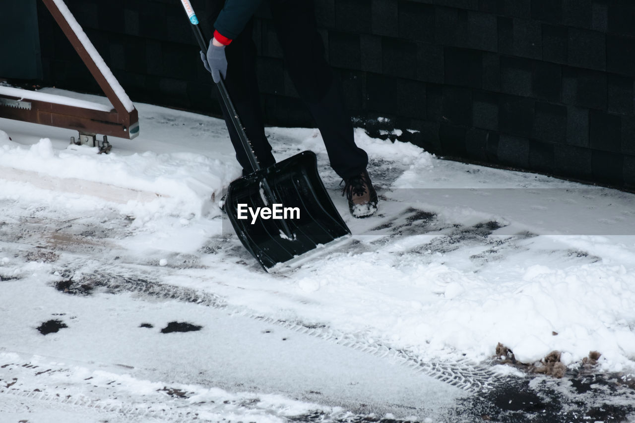 low section of man skiing on snow