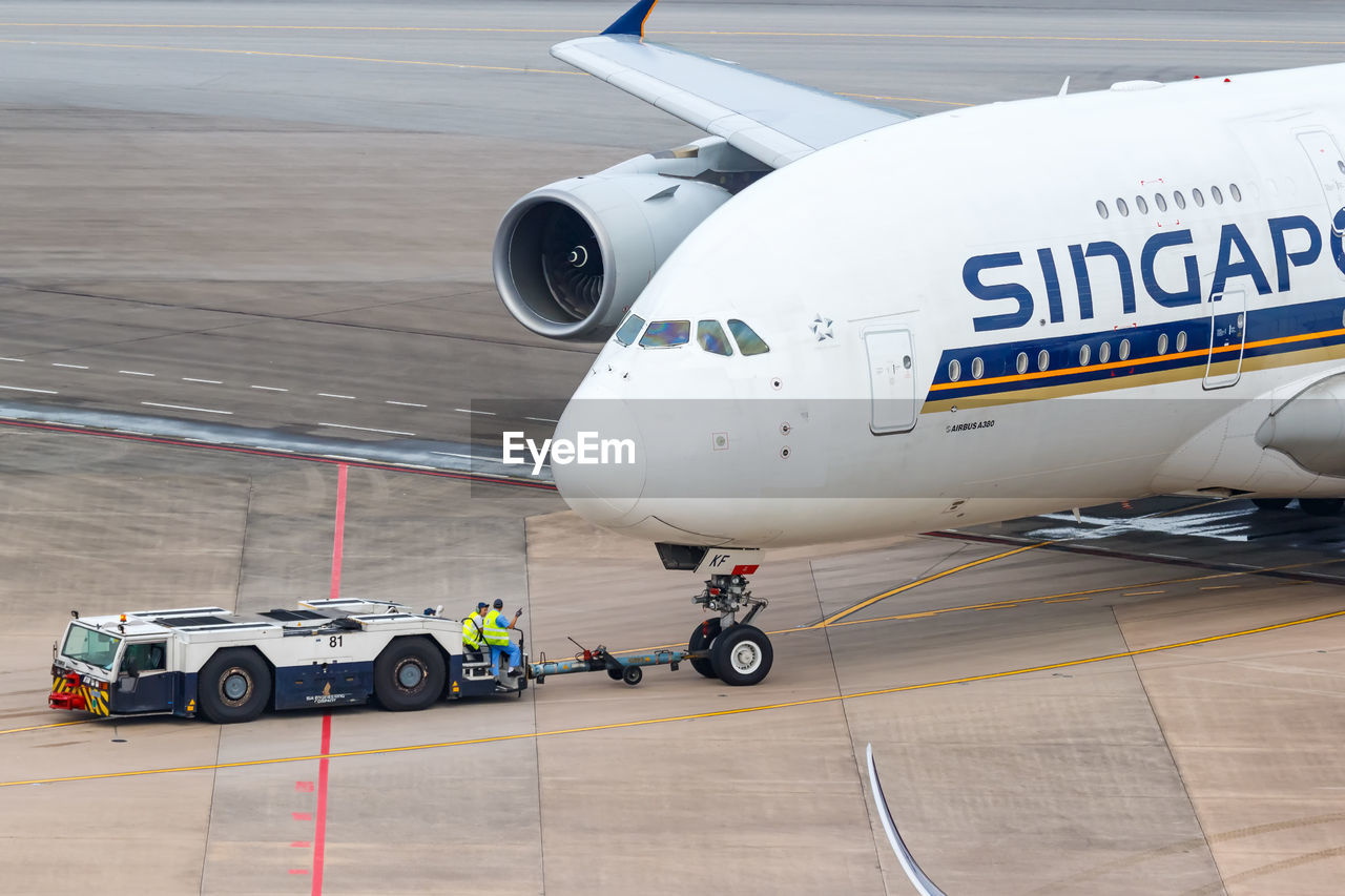 AIRPLANE ON AIRPORT RUNWAY