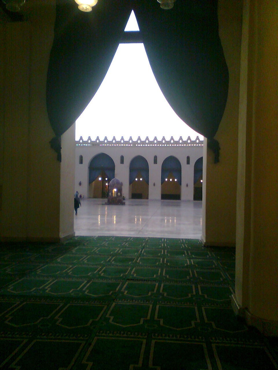 VIEW OF BUILDING SEEN THROUGH ARCH