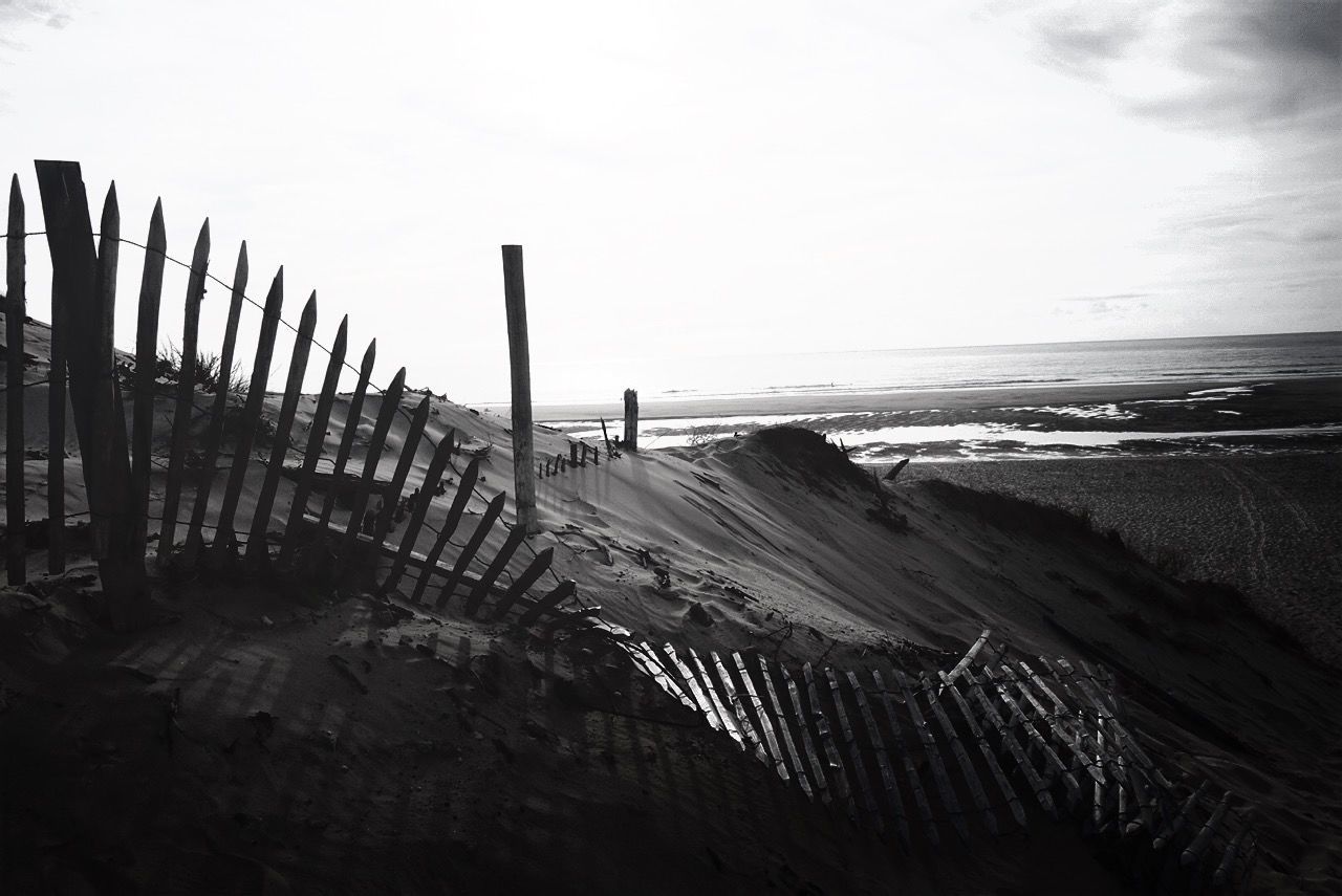 View of damaged fence on beach