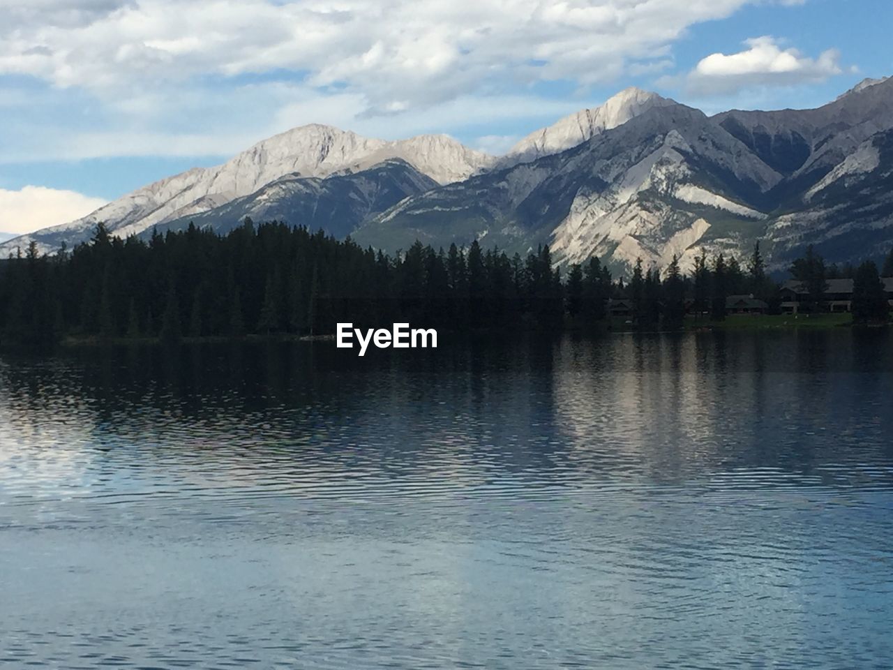 Scenic view of mountains and lake against sky
