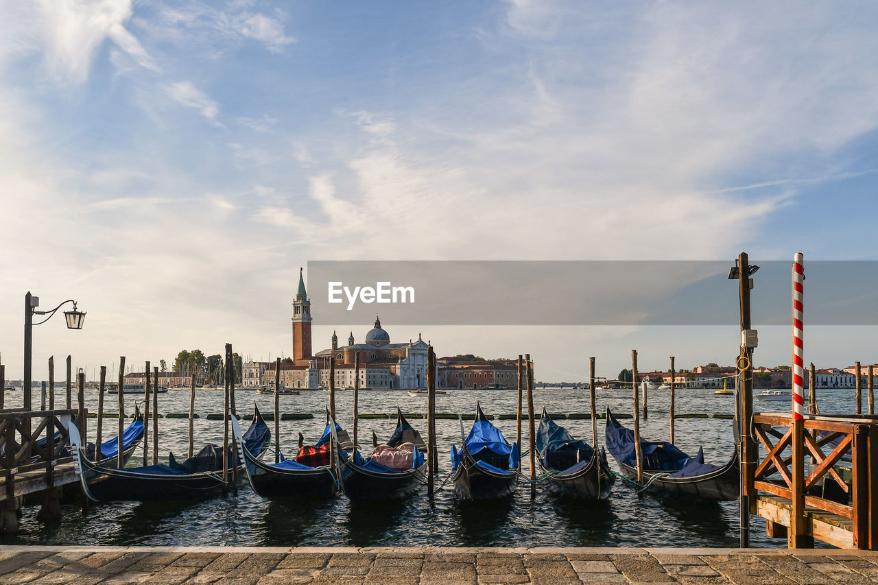 Gondolas with san giorgio maggiore island in the background, venice, italy