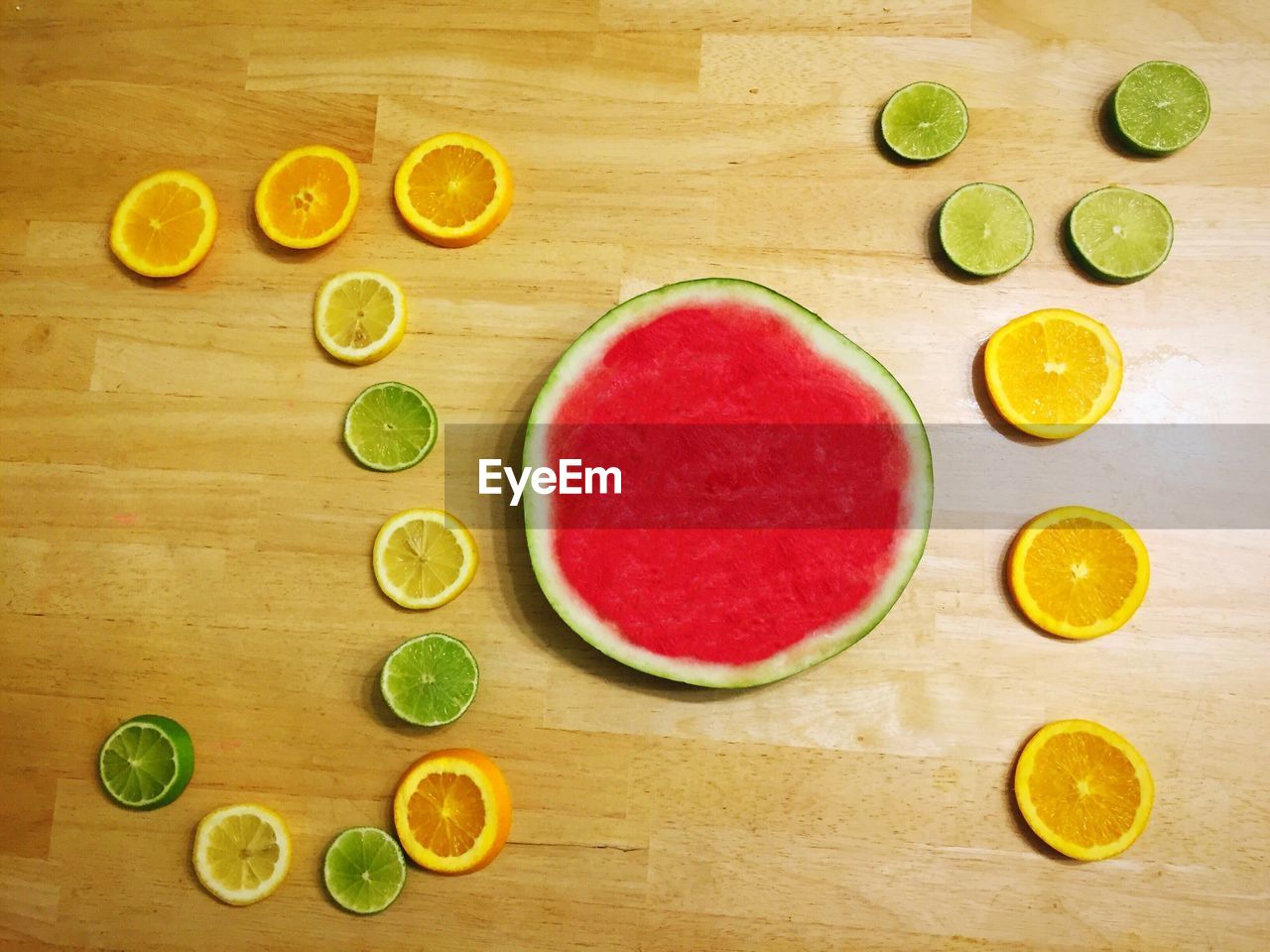 DIRECTLY ABOVE SHOT OF FRUITS AND KNIFE ON TABLE