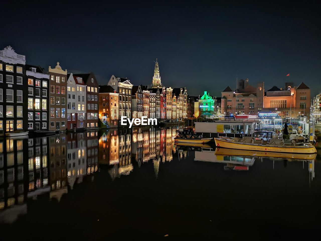 VIEW OF ILLUMINATED BUILDINGS AT NIGHT