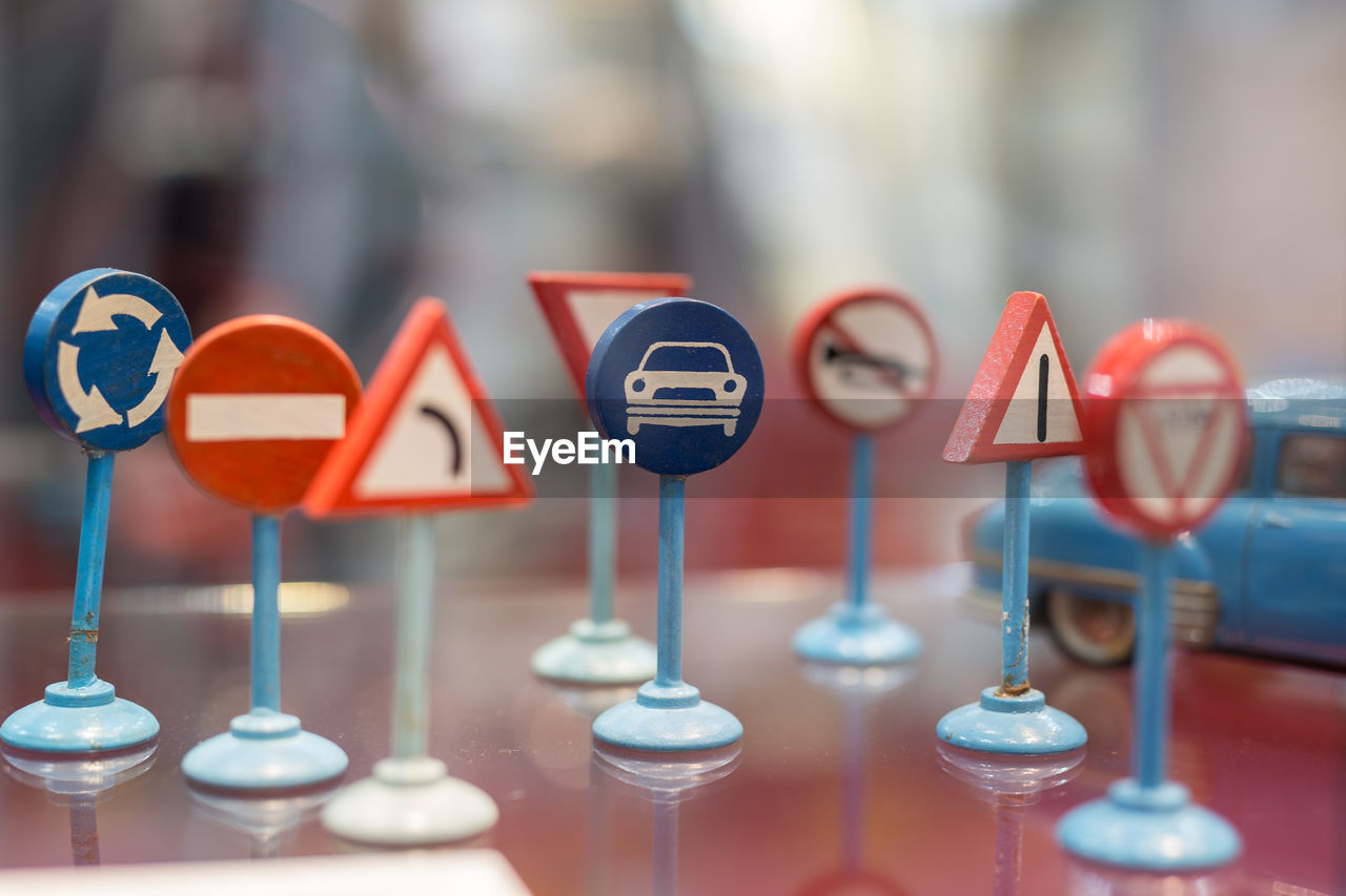 Close-up of of street sign on table