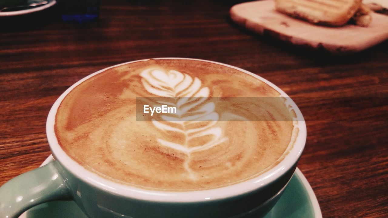 CLOSE-UP OF COFFEE ON TABLE