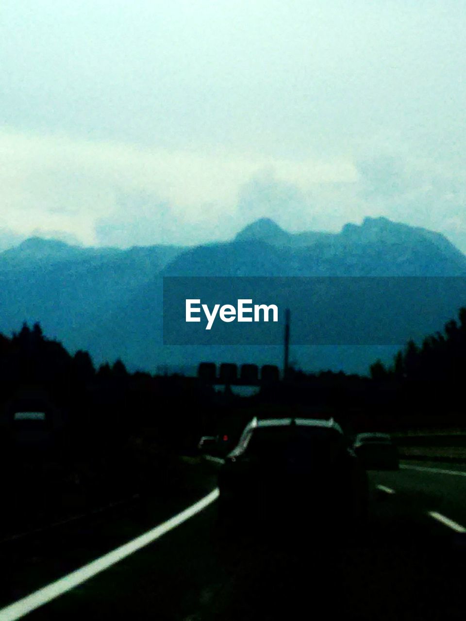 Cars on road against sky