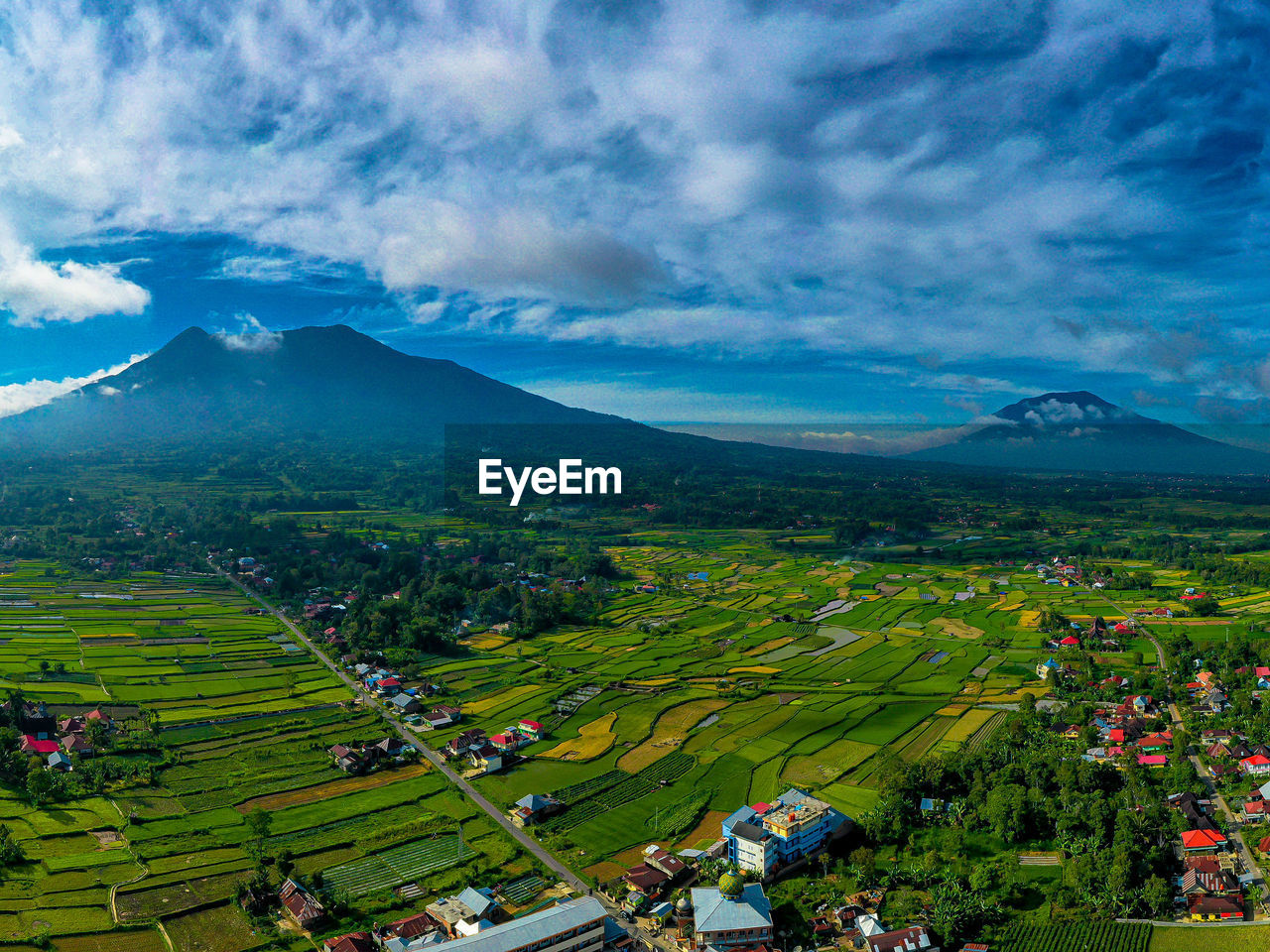 Aerial view of townscape against sky, marapi mount and singgalang mount
