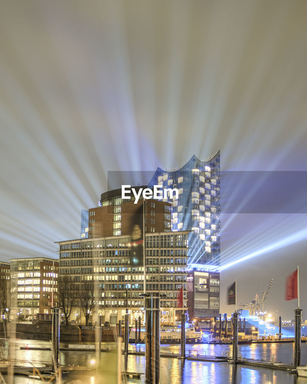 LOW ANGLE VIEW OF ILLUMINATED BUILDINGS AGAINST SKY