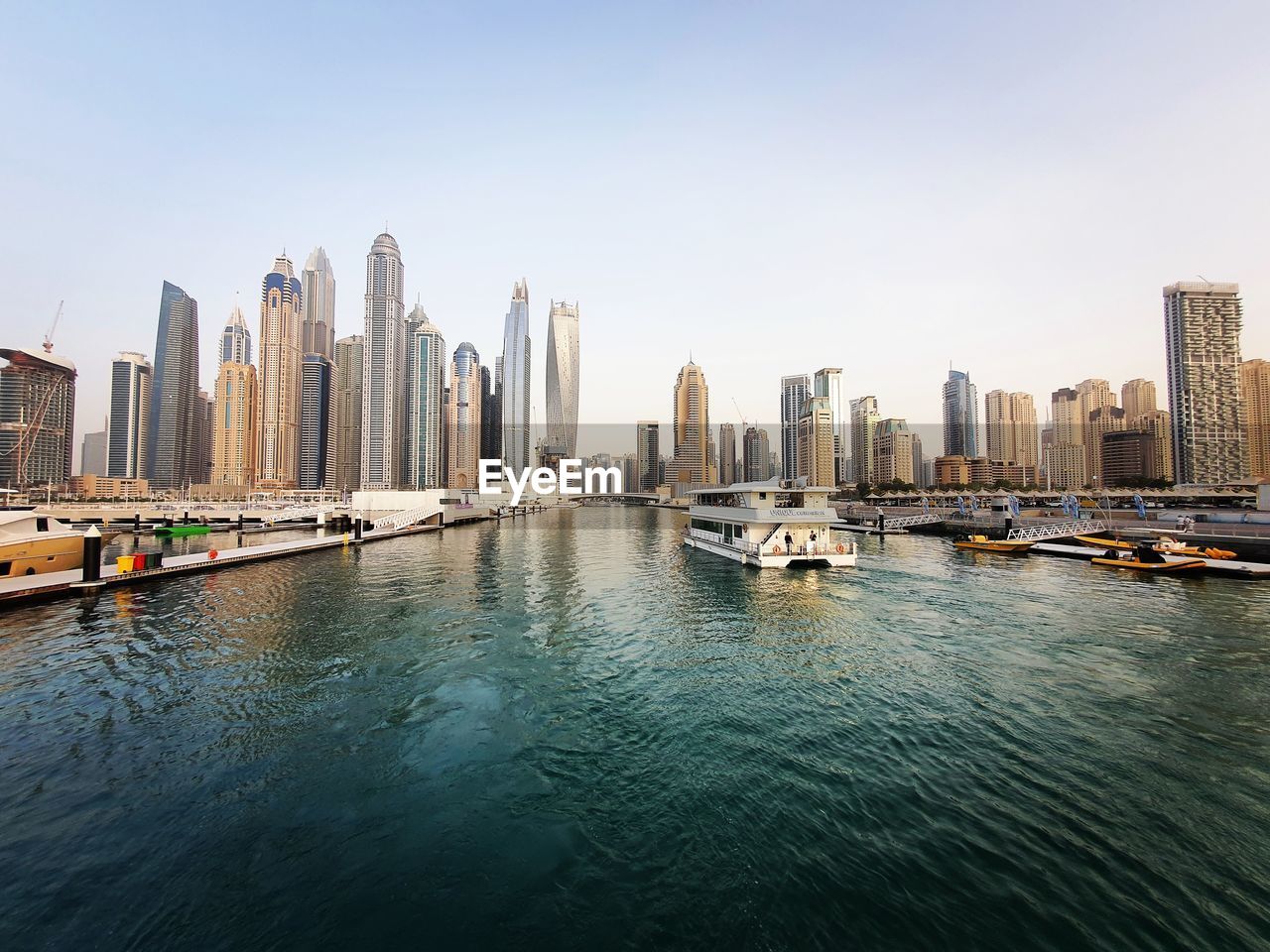 Panoramic view of river and buildings against clear sky