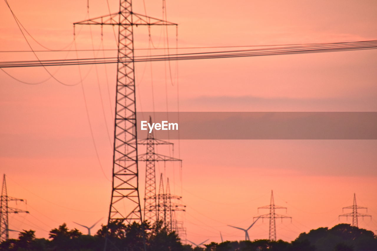 LOW ANGLE VIEW OF SILHOUETTE ELECTRICITY PYLON AGAINST SKY