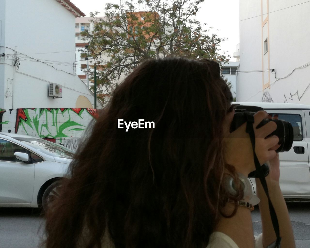 CLOSE-UP OF WOMAN WITH CAR