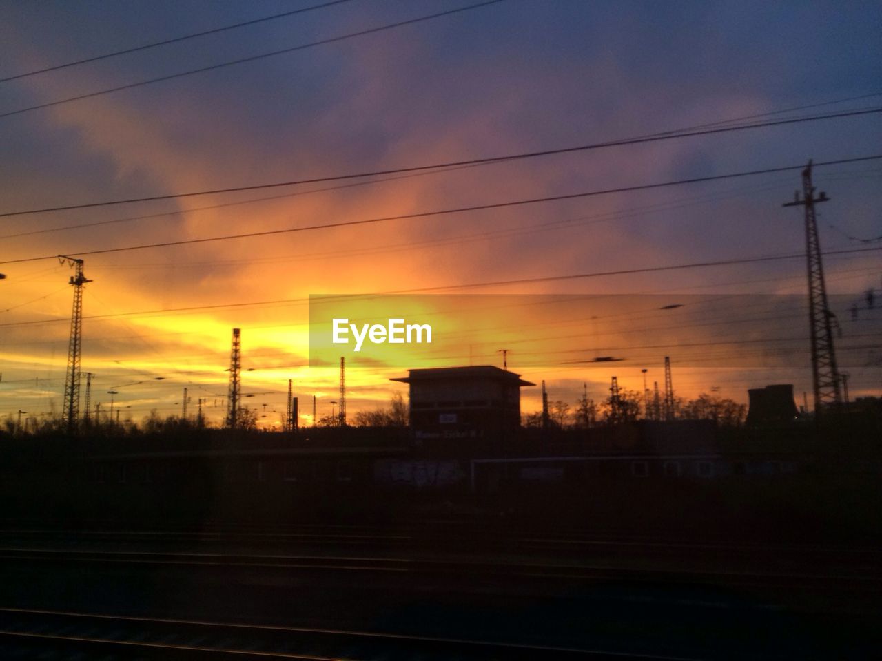 ELECTRICITY PYLONS AT SUNSET