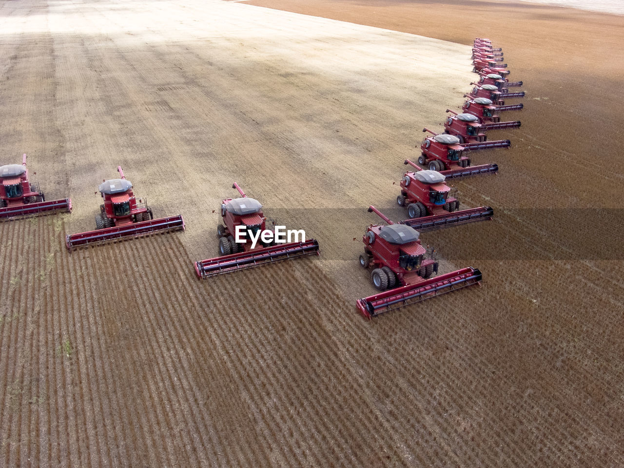 High angle view of combine harvesters on field