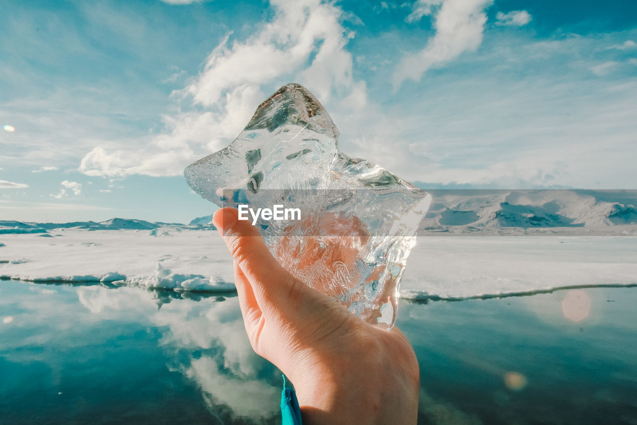 Close up man showing ice at glacier concept photo