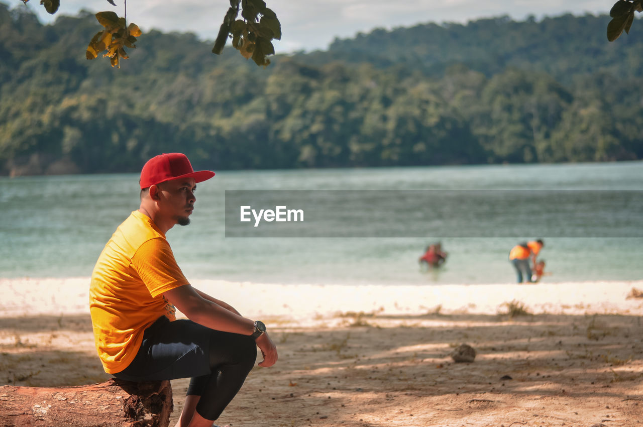 Side view of man on beach