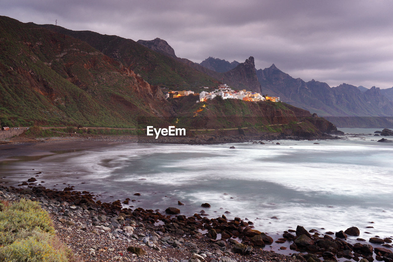 Scenic view of sea against cloudy sky