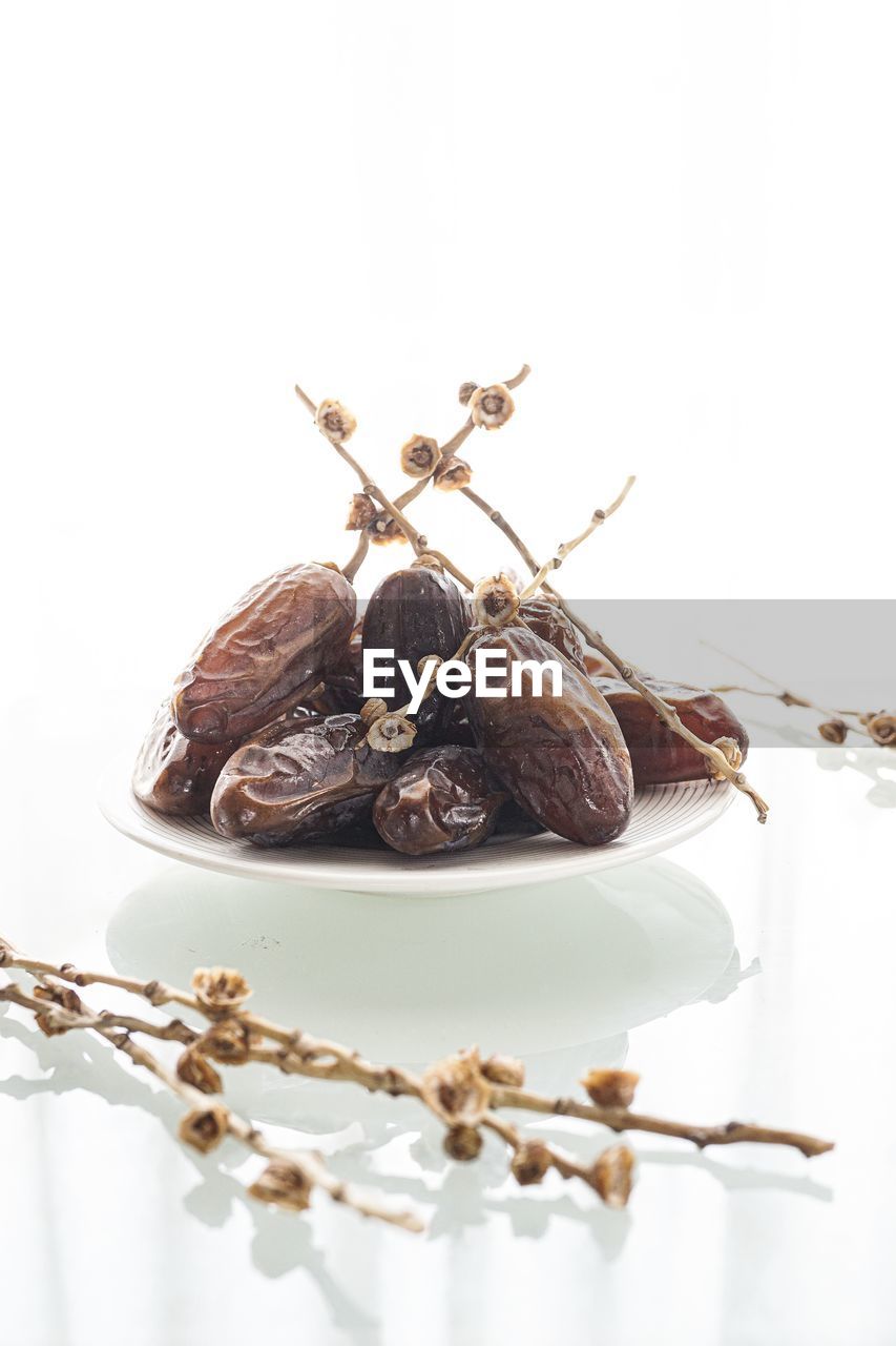 Close-up of dates-fruit served on table