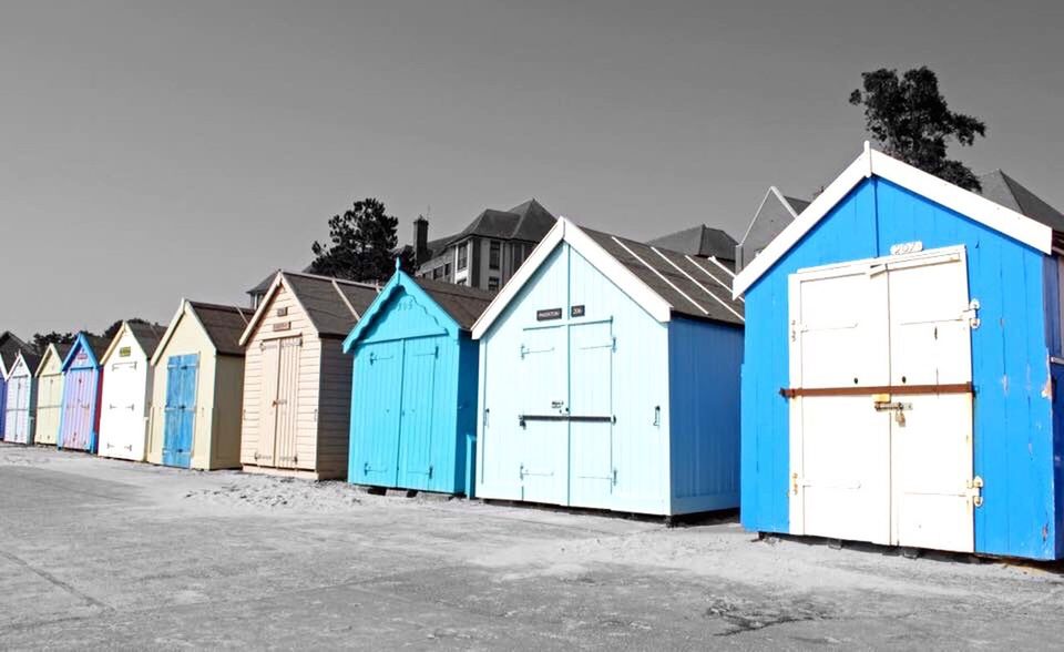 VIEW OF HOUSES AGAINST BLUE SKY