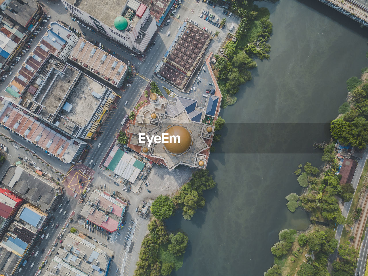 High angle view of buildings by river in city