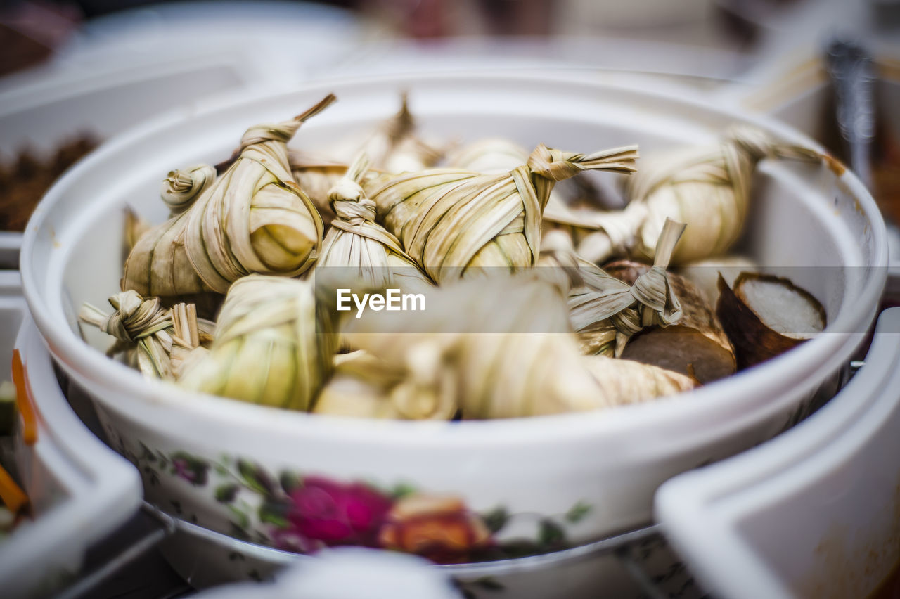 Close-up of ketupats in bowl