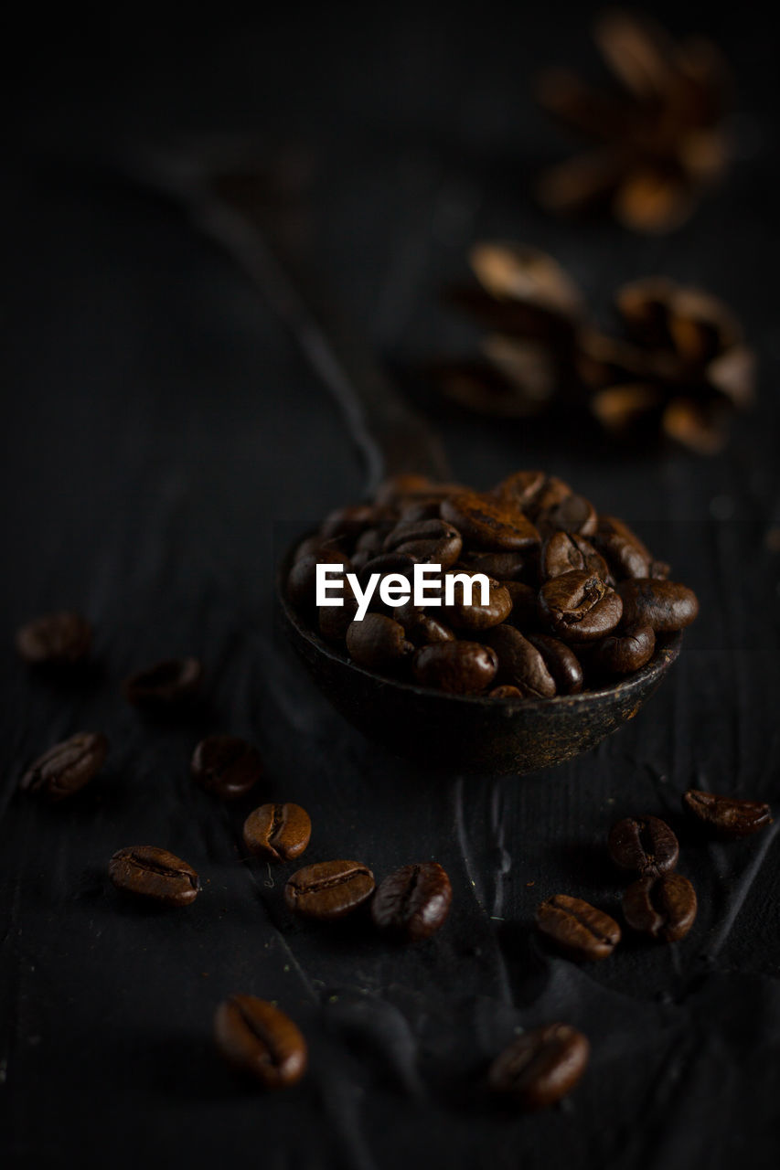 Close-up of roasted coffee beans on table