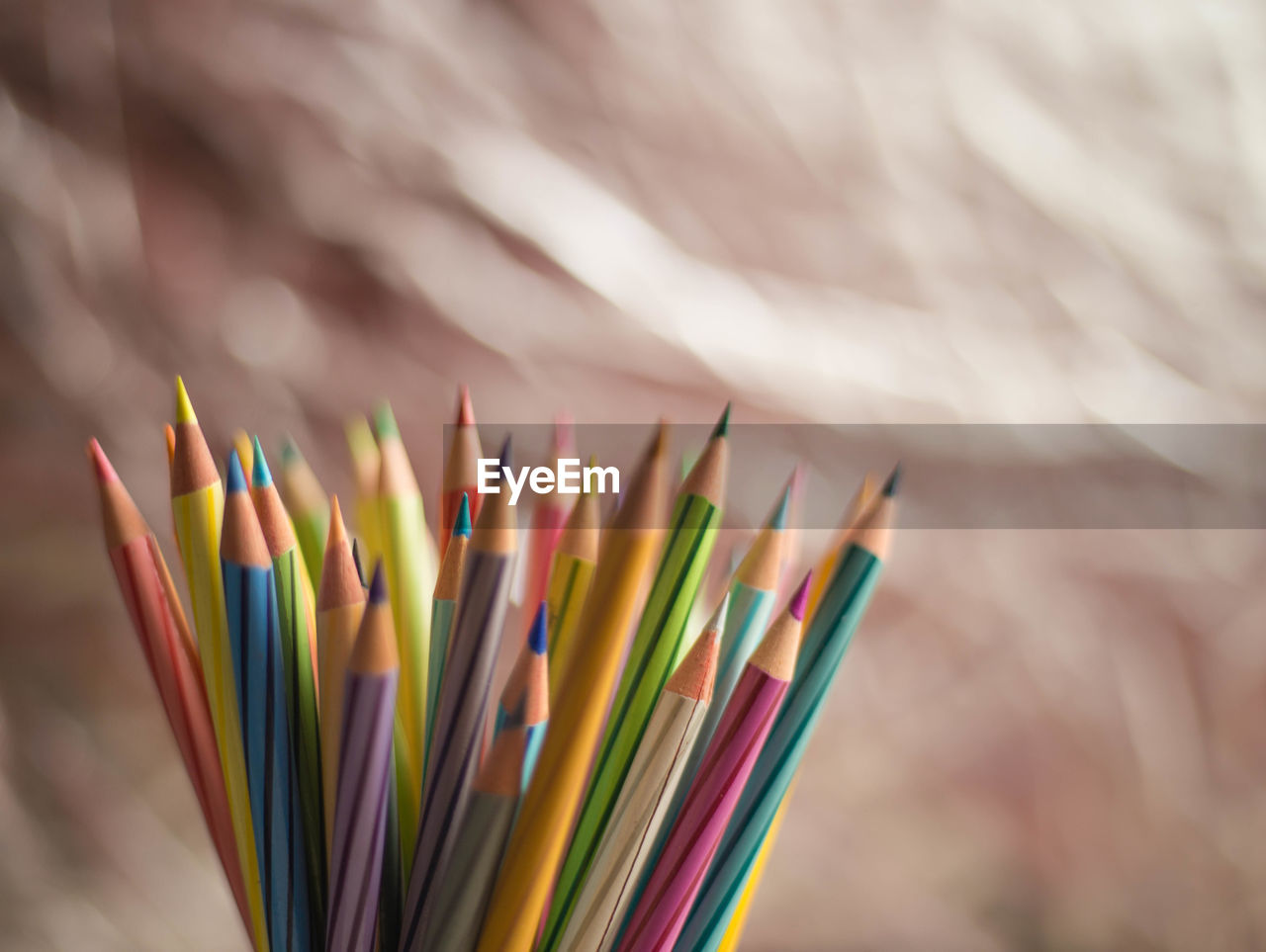 CLOSE-UP OF MULTI COLORED PENCILS IN WOOD