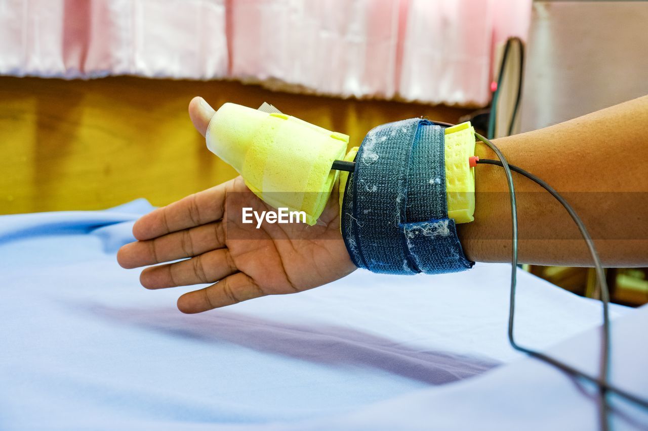 Cropped hand of person with medical equipment