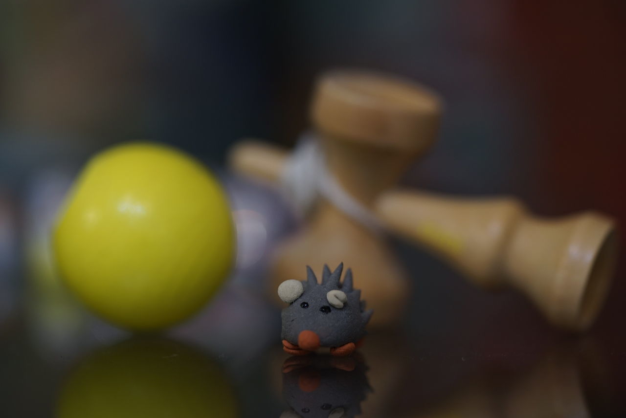 Porcupine toy and kendama on table