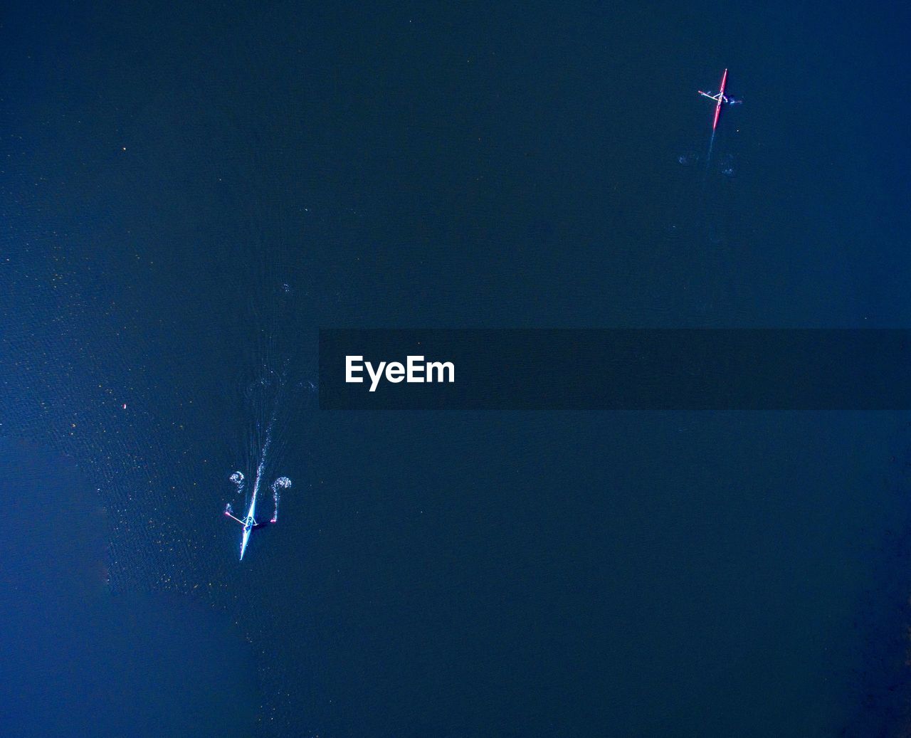 High angle view of boats on sea at night