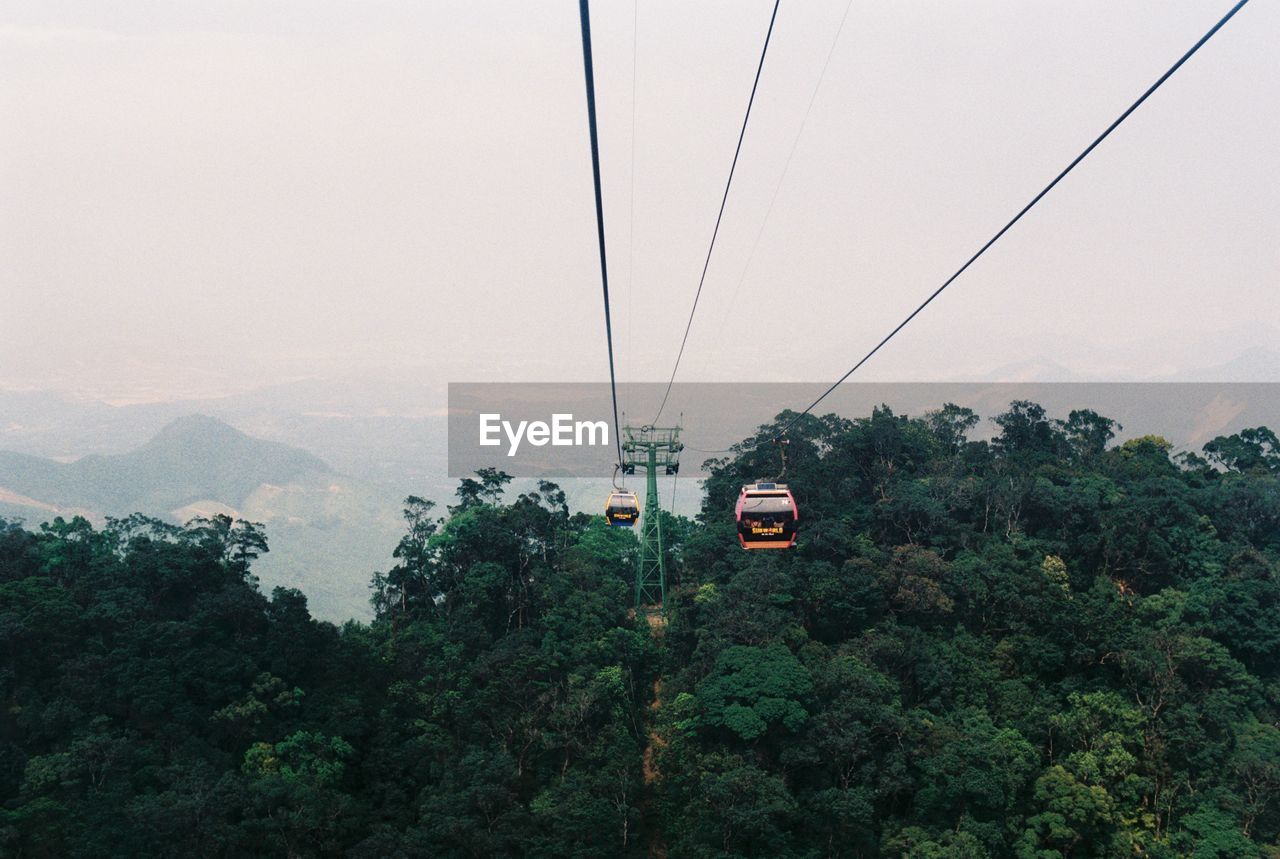 OVERHEAD CABLE CAR AGAINST SKY