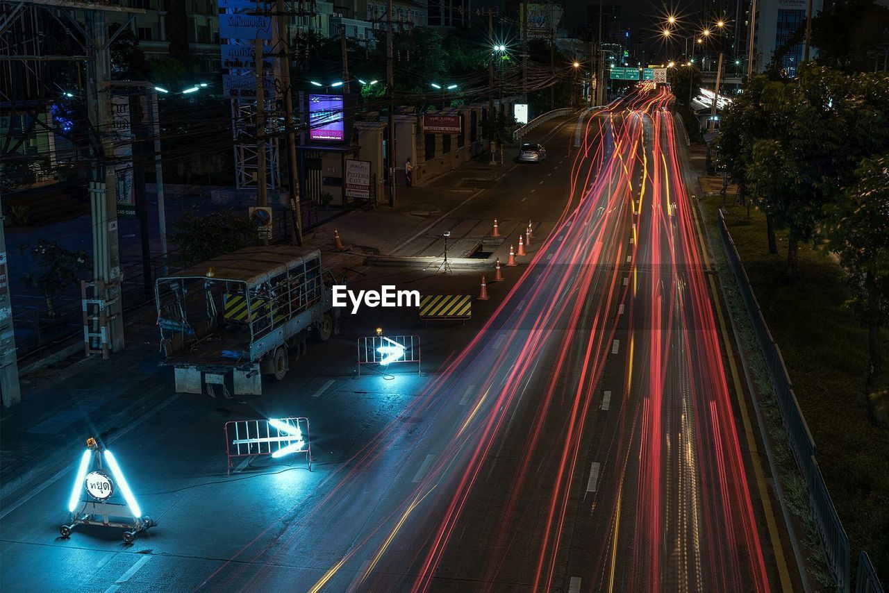 High angle view of light trails on road at night