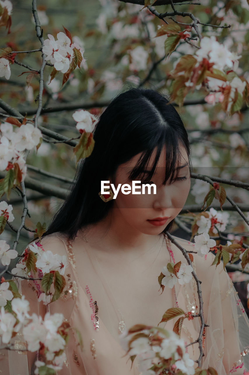 Close-up of young woman looking away