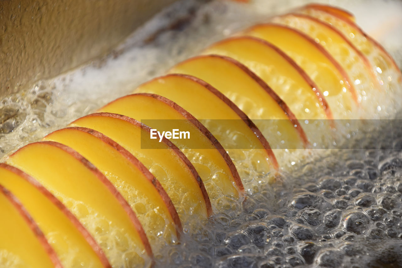 Close-up of fruit slices in oil