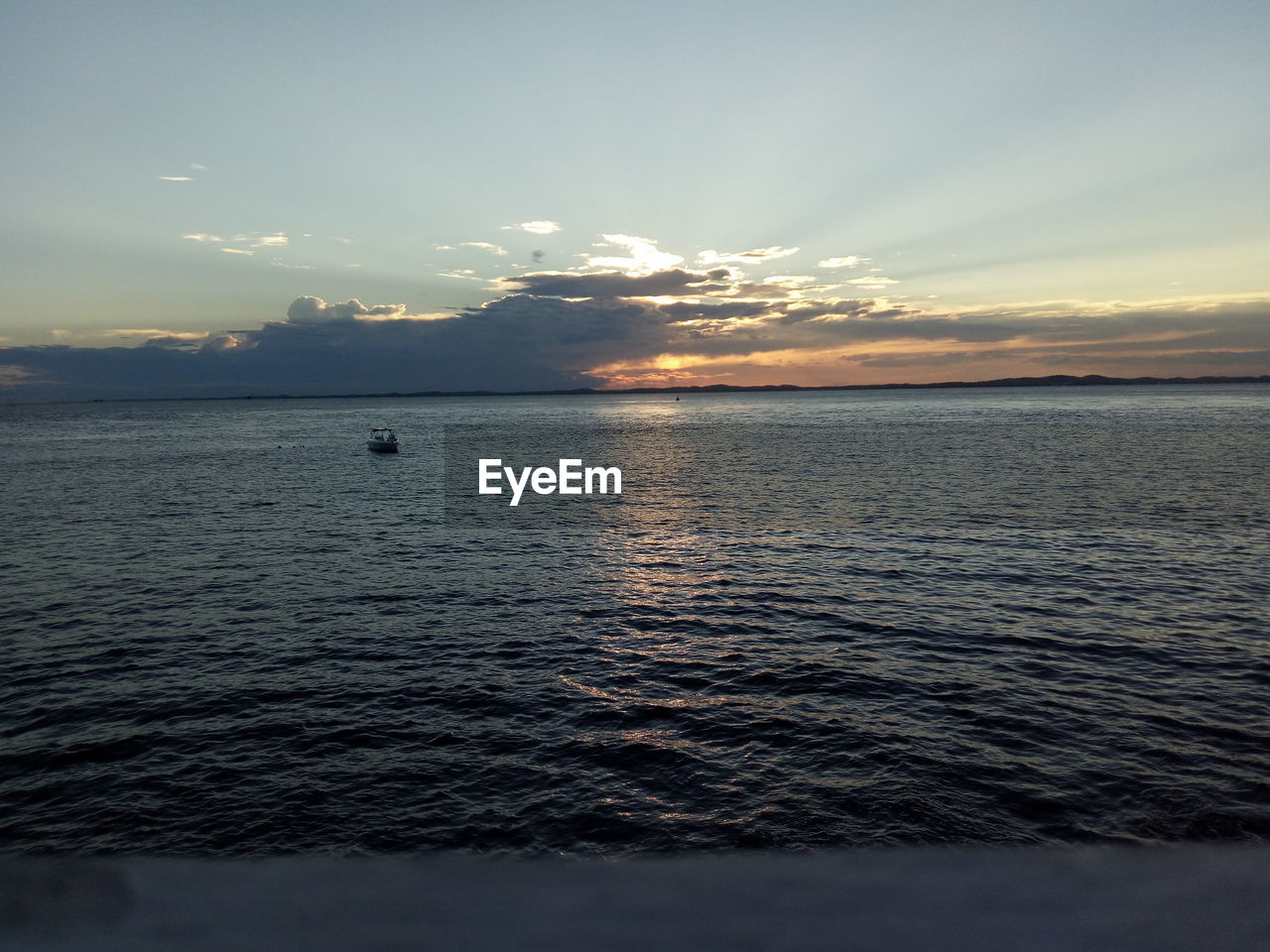 SCENIC VIEW OF SEA DURING SUNSET