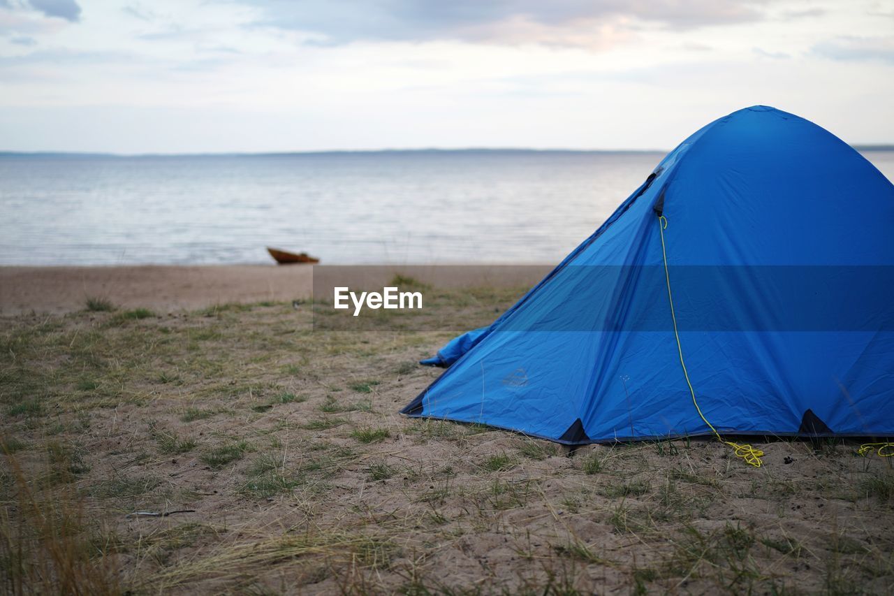 VIEW OF TENT ON BEACH AGAINST SKY